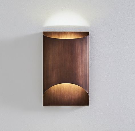 This wall lighting fixture consists of metal structure with no visible light source from any angle. This clean simple design allows for a modern look with a warm classic glow illuminating the wall or ceiling from either opening of its body. It is offered in glossy inox steel, brushed bronze and white varnished finishes. Wall Uplighters, Dining Room Lighting Chandeliers, Venetian Glass Mirror, Adjustable Wall Lamp, Traditional Wall Sconces, Mirror Dining Room, Mirrored Sideboard, Mirrored Console Table, Metal Wall Light