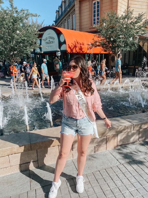 Sipping on rose drink in front of water fountain at Disney Epcot Epcot 21st Birthday Shirts, 21st Birthday At Disney World, 21st Birthday Epcot, Disney 21st Birthday Ideas, Epcot 21st Birthday, 21st Birthday Disney, Disney 21st Birthday, Drinking Around The World Epcot, Epcot Drinking Around The World