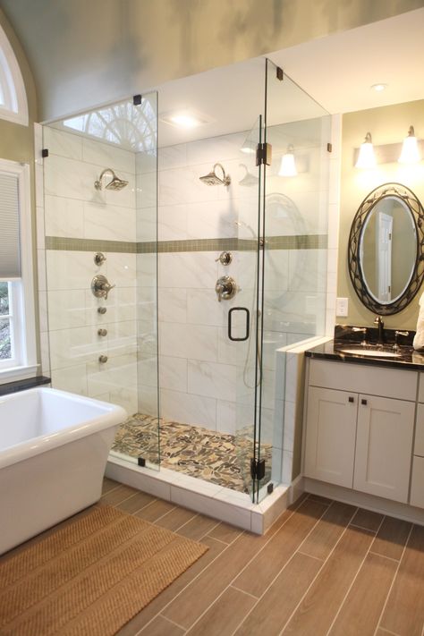 What a huge GREEN shower with double shower heads and frameless shower glass! #TeamGreen #Bathgoals #AtlantaRemodel #GreenBasementsAndRemodeling #Framelessshowerglass Double Shower Head Master Baths, 2 Shower Heads, Large Shower Tile, Double Shower Heads, Multiple Shower Heads, Master Bath Design, Master Bath Renovation, Master Baths, Bathroom Shower Walls