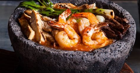 This is one of my favourite recipes. It uses the molcajete, a pre-Hispanic tools used by the Aztec and Maya that is a must-have item in all Mexican kitchens. Seafood Molcajete Recipe, Mocajete Recipe, Molcajete Recipe, Latin Dishes, Tequila Bar, Steak And Shrimp, Portuguese Food, Mexican Kitchens, Restaurant Ideas