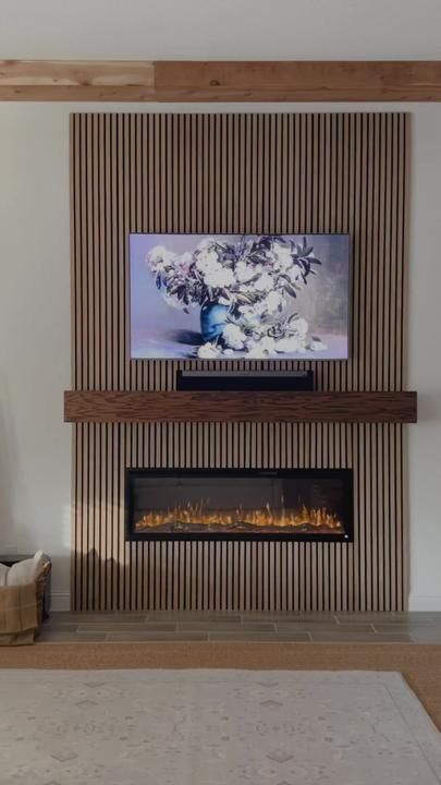 Wall Slat Fireplace, Wood Wall With Fireplace, Slat Wall High Ceiling, Modern Electric Fireplace Living Room, Wood Slat Accent Wall Tv, Slat Wall With Fireplace, Electric Fireplace Wood Wall, Diy Modern Electric Fireplace, Electric Fireplace Ideas With Tv Vaulted Ceiling