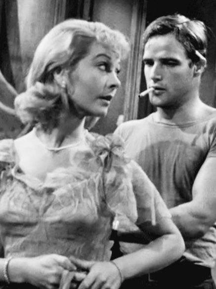 Blanche, Vivien Leigh, asks Stanley, Marlon Brando , for “ help with some buttons in back”. Although seemingly innocent Blanche is attempting to seduce her sister’s husband. I think the characters outward dislike for each other is due to sexual frustration. In any other scenario Blanche and Stanley would have f**k*d. Blanche Streetcar Named Desire, Stanley Kowalski, Vivien Leigh Movies, Blanche Dubois, Night Of The Iguana, Karl Malden, Kim Hunter, Jean Simmons, A Streetcar Named Desire