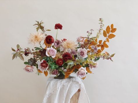 This arrangement by Kristen Caissie of Moon Canyon features Koko Loko roses, chrysanthemums, ranunculus, crab apples, and snowberries. “We love mixing caramel and lavender tones,” says the California-based floral designer. Her number one tip for creating your own fall floral arrangement? “Always go seasonal. You can’t lose.” Autumn Fern, Winter Floral Arrangements, Fall Flower Arrangements, Fall Floral Arrangements, Fall Flower, Flower Farmer, Spray Roses, To Infinity And Beyond, Flower Farm