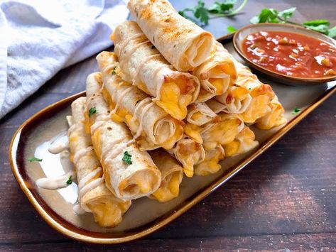 Beef And Cheese Taquitos, Spicy Sour Cream, Cheese Taquitos, Cinnamon Roll Monkey Bread, Taquitos Recipe, Fried Beef, Baked Cheese, Food Lab, Celebrity Chef