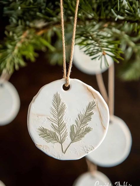 Wondering how to make your Christmas tree stand out with handmade decorations? These creative clay ornament ideas will help you craft beautiful, personalized ornaments that your family will love. Perfect for beginners and experienced crafters alike! Dough Christmas Ornaments Diy, Air Dried Clay Ornaments, Boho Christmas Ornaments Diy, Diy Dough Ornaments, Home Made Ornament, Clay Ornament Ideas, Homemade Clay Ornaments, Personalized Ornaments Diy, Dough Ornament Ideas