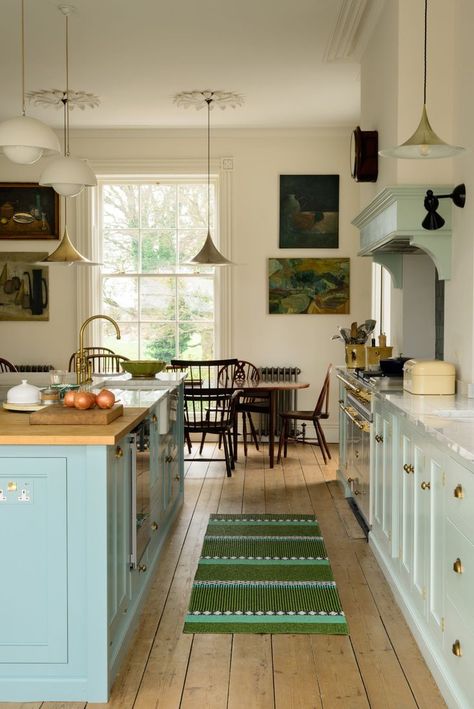 The cabinetry is from deVol’s Classic English Kitchen line and is all custom-made. It arrived from the company’s workshop as complete structures rather than in modular pieces—and that included the 13-foot island. The wide-plank pine floor boards are original: formerly covered by carpeting, they were plucked of staples and nails and then hand sanded and oiled. Food sometimes gets dropped between the cracks and has to be “hoovered” up (see “Speak the Local Lingo” below). Classic English Kitchen, Koti Diy, Kitchen Goals, Floor Boards, Devol Kitchens, Georgian Townhouse, English Kitchen, English Kitchens, Kitchen Size