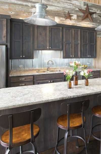 23 Tin Backsplash Design Ideas for Your Kitchen | Sebring Design Build Corrugated Tin Backsplash Kitchen, Tin In Kitchen, Tin On Walls Ideas Kitchen, Sheet Metal Backsplash Kitchen, Corrugated Metal Wall Kitchen, Log Cabin Kitchen Backsplash Ideas, Galvanized Backsplash Kitchen, Corrugated Backsplash Kitchen, Log Cabin Kitchen Backsplash