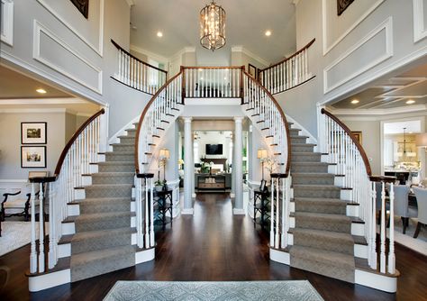 DOUBLE STAIRS FOYER | Dramatic Two-story foyer with elegant curved staircases Foyer Staircase, Foyer Lighting Fixtures, Double Staircase, Foyer Decorating, Coastal Living Rooms, Foyer Design, Curved Staircase, Grand Staircase, Story House