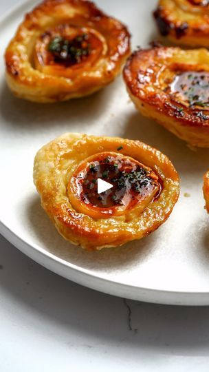 107K views · 2.1K reactions | Brie Upside Down Bites 🥹🫶🏻 remaking my viral puff pastry upside down bites hot honey style. Ingredients: * 8 mini brie rounds. * 1 puff pastry sheet. * honey (about 1/2-1 tbsp per bite plus more for the hot honey. * salsa macha to taste. * 1 egg (beaten with a touch of water). * chives to taste. * 1 cookie cutter (3.5 inch). * Flaky sea salt. Directions: 1. Roll out your puff pastry to about 1.5 its size. Cut 8 rounds. 2. Place parchment paper on a sheet pan, add the honey in little dollops, score the brie and place on top. Wrap the puff pastry over the brie as tightly as you can. 3. Pinch the edges with a fork. 4. Brush with the egg and bake at 400F for 20-22 min. 5. Mix together some honey with salsa macha. I did 1 tbsp salsa macha and 1/4 c honey. 6. Top Coconut Appetizers, Small Bites Appetizers, Puff Pastry Appetizers, Brie Bites, Bite Size Appetizers, Hot Honey, Puff Pastry Sheets, Appetizer Bites, Pastry Sheets