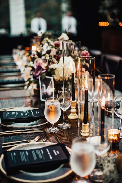 These tall black tapers—Storied Events housed them in glass hurricanes—exemplify how a gothic aesthetic can feel regal and charming. Moody Romantic Outdoor Wedding, Thanksgiving Wedding Decorations, Moody Head Table, Black Candles Wedding, Moody Tablescape, Romantic Tablescape, Centerpiece Inspiration, Courtney Miller, Garden Dinner