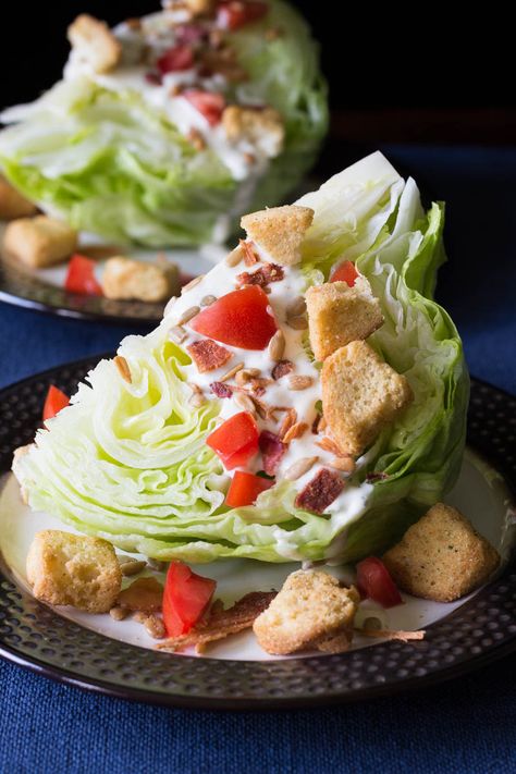 This classic wedge salad recipe is made with crisp iceberg lettuce, crumbly bacon, creamy dressing, and more. You'll love the delicious flavor and texture! Paleo Ranch Dressing, Iceberg Wedge Salad, Iceberg Lettuce Salad, Wedge Salad Recipes, Blue Cheese Dressing Recipe, Resep Salad, Wedge Salad, Southern Kitchen, Blue Cheese Dressing