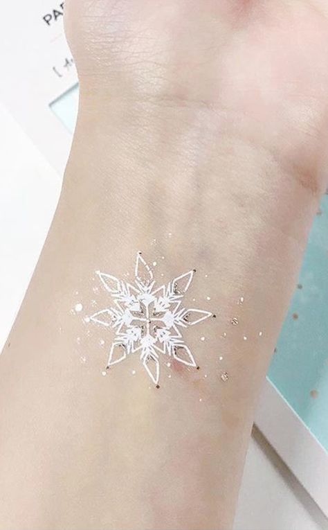 White ink tattoo designs do's and don'ts Tattoo White Ink, Small Snowflake Tattoo, Snowflake Tattoo, Snow Tattoo, Tattoo White, Snow Flake Tattoo, Optical Illusion Tattoo, White Ink Tattoo, Triangle Tattoos