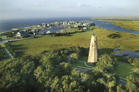 Bald Head Island with lighthouse (foreground) at the mouth of the Cape Fear River, southeastern North Carolina.    Credit: Thinkstock/Jupiterimages Bald Head Island Nc, Visit North Carolina, Bald Head Island, Winter Beach, Gorgeous Scenery, Bald Head, Bald Heads, Coastal Towns, Beach Town