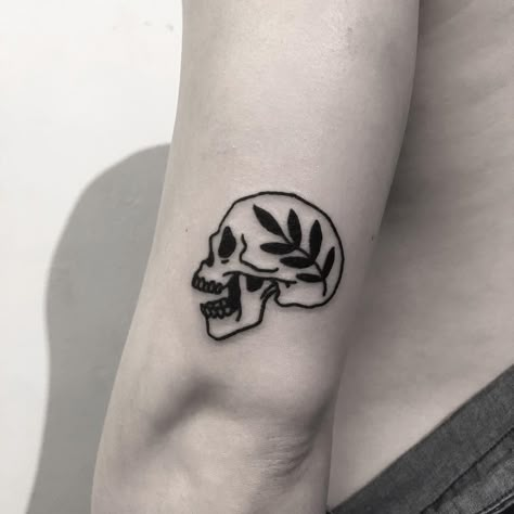 Small skull and branch tattoo inked on the back of the left arm Tattoo Branch, Tiny Skull Tattoos, Small Skull Tattoo, Tattoos With Deep Meaning, Outer Forearm Tattoo, Black Skull Tattoo, Red Tattoo Ideas, Skull Girl Tattoo, Simple Skull