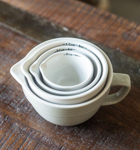 These charming measuring cups are inspired by vintage batter bowls. Perfect for your cooking needs, the inside of each of these measuring cups is marked in both ounces and cups. One side of each is designed with a V-shaped spout for easy pouring. They stack inside each other for easy storing and are dishwasher safe! Pretty Measuring Cups, Vintage Measuring Cups, Cute Measuring Cups, Shutters Living Room, Vintage Mixing Bowls, Dream Ideas, Rv Kitchen, Batter Bowl, Kitchen Dinnerware