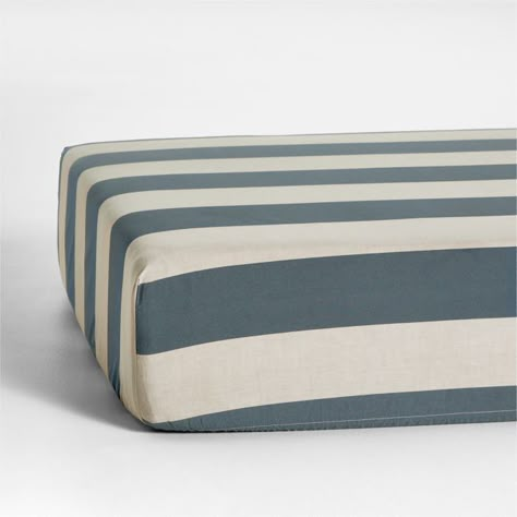 Give your nursery some vacay vibes with the bold, cabana-style stripes of our Riviera Crib Fitted Sheet. The organic cotton chambray with slate blue stripes offers a subtly textured, irresistibly soft feel that's still light and breathable. For a playful nursery look, pair the sheet with our matching changing pad cover.   • 100% organic cotton chambray, grown without chemicals or pesticides  • Passes OEKO-TEXr STANDARD 100 textile safety tests  • Elastic band keeps sheet in place  • This item ca Sports Nursery, Tree Interior, Crib Fitted Sheet, Crib Bedding Boy, Modern Crib, Boys Crib, Vacay Vibes, Baby Crib Bedding, Blue Nursery