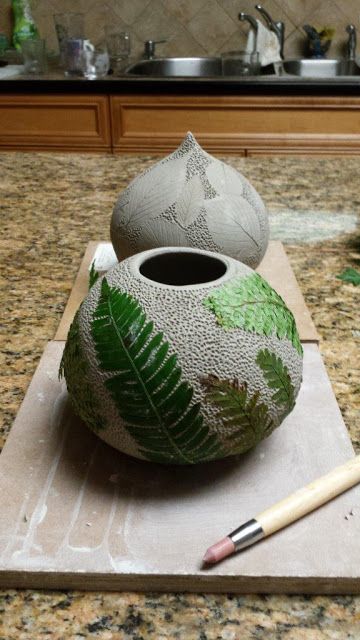 Ceramic pottery vessel with leaf imprints, this time fern fronds, in progress. Leaf Imprints In Clay, Pottery Imprint Ideas, Fern Pottery, Botanical Ceramics, Ceramic Garden Art, Pottery Plant Pots, Leaf Pottery, Pottery Vessels, Ceramic Leaf