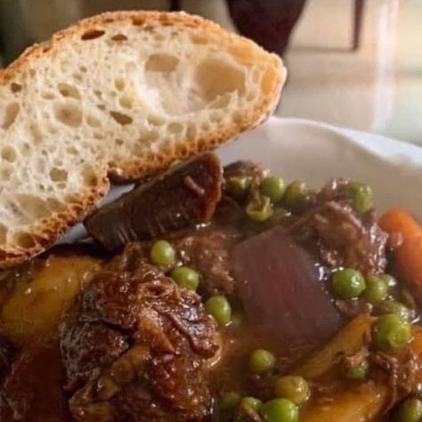 Daniel Mancini on Instagram: "So many requests for my Italian Beef Stew recipe. The key to achieving the rich deep flavor of this Stew is to brown the beef. The brown bits that are left in the pot are the foundation for the rich flavor we are building. You'll need- •2.5-3 lbs beef chuck stew meat cut into small cubes seasoned with salt and pepper •6-garlic cloves smashed •1/2-cup minced onion •2-medium yellow onions quartered •4-carrots cleaned cut into quarters •2-celery stalks cut into 1" pieces •4-large red potatoes quartered •1-cup of frozen peas •1-cup dry red wine chianti is good •1-qt beef or chicken stock •1/2-cup of tomato sauce •Salt •Pepper •1-tbs of flour •2-bay leaves •1/4-cup vegetable oil •2-tbs tomato paste 1-Pre heat oven to 325 degrees. 2-In a heavy oven proof Beef Chuck Stew, Daniel Mancini, Italian Beef Stew, Brown Foundation, Italian Beef, Dry Red Wine, Beef And Potatoes, Stew Meat, Beef Chuck