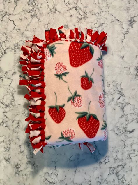 Strawberry Tie Fleece Blanket Handmade  Fleece 50 inches length X 28 inches width or 60 inches length X 48 inches width  Introducing our delightful Strawberry Fleece Tie Blankets, available in both adult and baby sizes! These blankets are made with the softest, coziest fleece material and feature a lovely strawberry pattern that is sure to brighten up any room. The adult size blanket measures a generous 60 inches length by 48 inches width, making it the perfect size to snuggle up under on the co Tie Blankets Fleece Sizes, Jj Blanket, Tie Blankets Fleece, Strawberry Bedroom, Tie Fleece Blanket, Tie Knot Blanket, Strawberry Blanket, Strawberry Picnic, Crochet Bedsheets