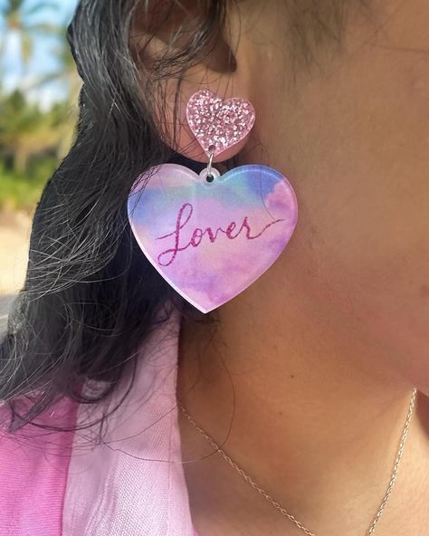 $14 LOVER ERA Earrings Get ready to make a statement with the stunning Lover Era Earrings! 2” long 1.5” in diameter Acrylic Order yours here⬇️ https://tealtigershop.com/products/lover-era-earrings?utm_content=ios&utm_medium=product-links&utm_source=copyToPasteboard 📦Ships from MS, next business day, or pick up in store at 767 Church St, Lucedale, MS. 🛍️ #loverera #earrings #boutique #boutiqueshopping #shopsmall Lover Era Earrings, Lover Era Accessories, Taylor Swift Lover Earrings, Fun Multicolor Valentine's Day Earrings, Lover Earrings, Lover Era, Business Day, Boutique Shop, Get Ready