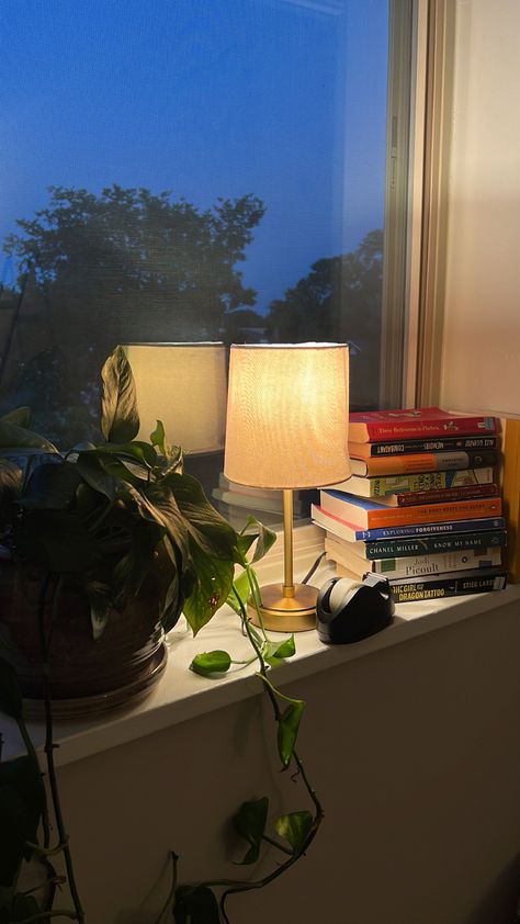 Lamp On Top Of Books, Bedside Lamp On Books, Books On Nightstand Aesthetic, Book Lamps Stacked, Self Care Books, Green Library Lamp Aesthetic, Dc Apartment, Bedroom Book, Book Lamp