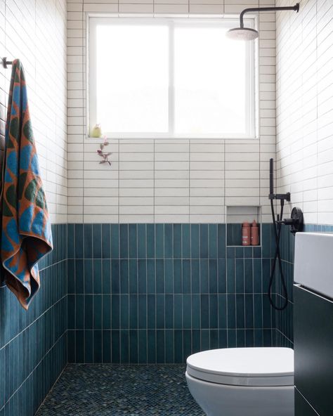 Dare to be bold with two-toned showers, the ultimate fusion of color and personality that will transform your space into an oasis of self-expression. Shower Tile: Makoto 2.5x10 in Arashi Blue and Shoji White Designed by @christamartinstudio 📸 @alisonbernier Arashi Blue Tile, Two Toned Tile Bathroom Walls, Makoto Arashi Blue Tile, Color Block Bathroom Tile, Colorblock Shower Tile, Two Tone Subway Tile Bathroom, Two Toned Tile Bathroom, Two Color Tile Shower Ideas, 2 Tone Tile Bathroom