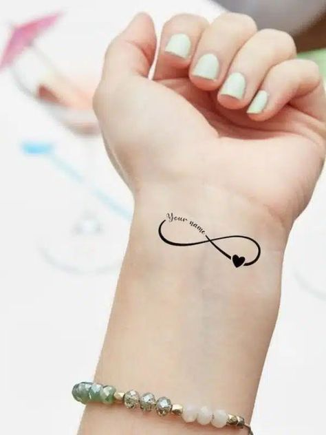 Infinity Vine Tattoo, Infinity With Names Tattoo, Eternity Tattoo Infinity Signs, Infinity Tattoo On Ring Finger, Cute Infinity Tattoos, Small Infinity Tattoos For Women, Best Friend Infinity Tattoos, Small Tattoos Infinity, Simple Infinity Tattoo Infinity Sign With Heart Tattoo, Ad Tattoo Designs, Infinity Sister Tattoo Ideas, Memorial Name Tattoos For Women, Infinity Small Tattoo, Infinite Symbol Tattoo, Infinity Symbol Tattoo Design, Best Friend Infinity Tattoos, Small Infinity Tattoos For Women