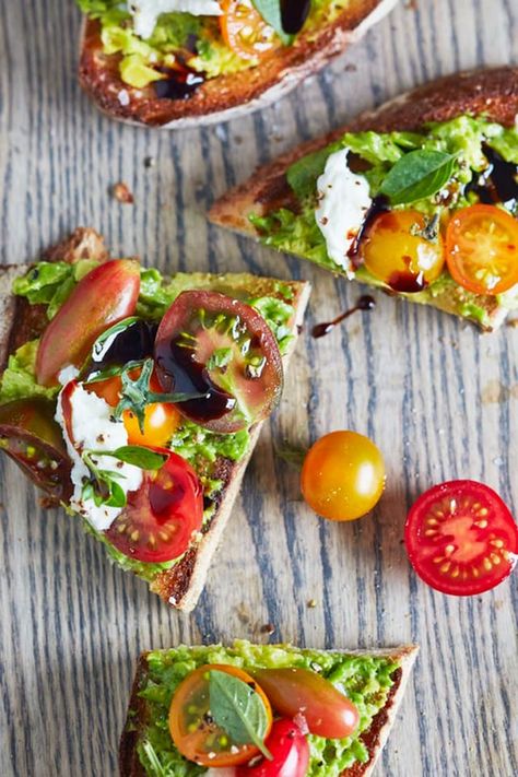 When it comes to avocado toast, the best slices go well beyond two ingredients. If you require further proof, let us present this caprese avocado toast. All the components of a caprese salad — from the ripe tomatoes and the creamy mozzarella to the fresh basil and the tangy balsamic glaze — are a good friend to the cool avocado. If there was ever an example of when the whole is better than the sum of its parts (and we're talking about irresistible parts!), caprese avocado toast nails it on th... Caprese Avocado Toast, Caprese Avocado, Avocado Toast Recipes, Avocado Recipes Easy, Mediterranean Diet Breakfast, Mediterranean Recipes Healthy, Mediterranean Breakfast, Mediterranean Diet Recipes Dinners, Med Diet