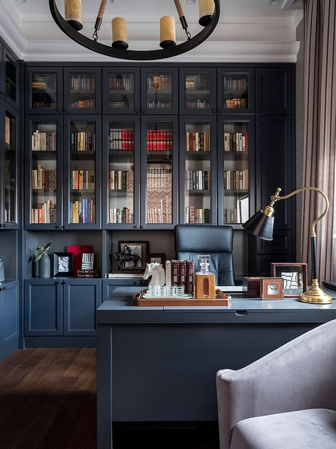 Luv this: adding doors w/shape & style to the side opening but leaving the center opening w/out the door?... 25 Home Office Shelving Ideas for an Efficient, Organized Workspace Masculine Home Offices, Masculine Home Office Ideas, Blue Home Offices, Masculine Home Office, Home Office Shelves, Office Bookshelves, Home Office Library, Office Shelving, Office Shelf