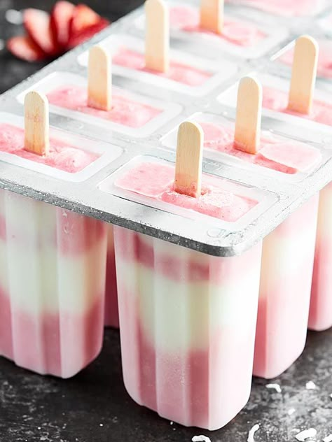 Strawberry Coconut Popsicles, my favorite summer treat! Full of greek yogurt and fresh fruit, the ingredient list is short, the popsicles are creamy dreamy, and you better believe they're healthy enough to enjoy without the guilt! showmetheyummy.com #popsicles #greekyogurt Homemade Fruit Popsicles, Healthy Popsicle Recipes, Coconut Popsicles, Ice Pop Recipes, Popsicles Recipe, Healthy Popsicles, Yogurt Popsicles, Fruit Popsicles, Ice Cream Pops