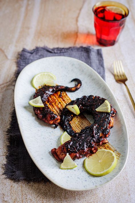 Spicy, smoky and sweet, this Mexican-inspired grilled octopus and ancho salsa recipe that will send your taste buds dancing. Tender octopus gets boiled in a zesty, flavorful broth packed with Mexican spices, then hits the grill to achieve that perfect charred exterior while maintaining its juicy tenderness. #mexican #octopus #grilled #ancho #salsa #anchosalsa #grilledoctopus #mexicanoctopus Ancho Salsa, Mexican Seafood, Octopus Recipes, Grilled Octopus, Mexican Spices, Luxury Food, Cocktail Desserts, Homemade Salsa, Food Garnishes