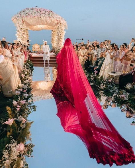 From bride's beautiful self-design red lehenga to exquisite baby breaths phoolon ki chaddar, from her dupatta trail to bridesmaids' twinning outfits, from her dream bridal entry to breathtaking varmala photos, there's nothing not to love about this gorgeous bride Thailand wedding 😍 Taf a friend who is getting married soon and share this dreamy wedding inspiration with them. Couple: @kashtag90 @jhalakshah_ Planner: @krish_events Venue: @avanihuahin Decor: @dp_designbypeerapach Light and So... Bridal Entry Songs, Indian Bridal Entry, Songs Trending, Twinning Outfits, Indian Wedding Venue, Indian Wedding Pictures, Bridal Entry, Bride Entry, Bride Photos Poses