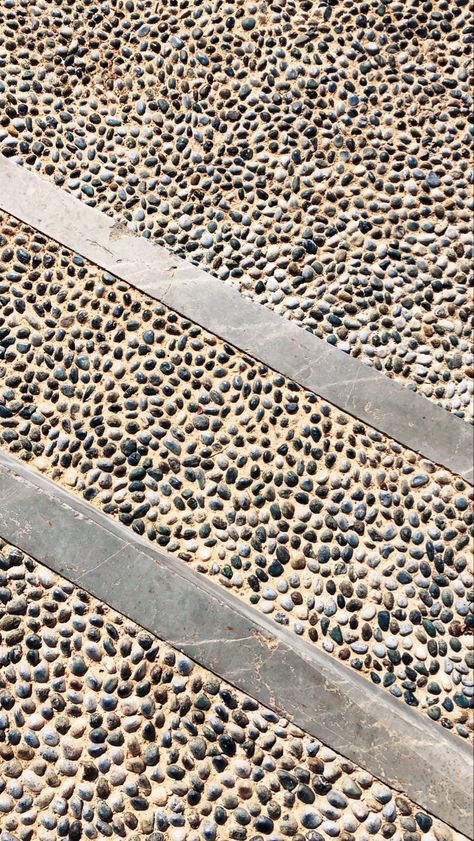 Pebbles embedded into concrete on a pathway at Amanruya Paving And Pebbles Garden Paths, Pebble Paving Ideas, Pebble Wash Floor Outdoor, Parking Pavers, Pebble Concrete, Pebble Pathway, Pebble Wash, Gravel Driveway Landscaping, Pebble Driveway