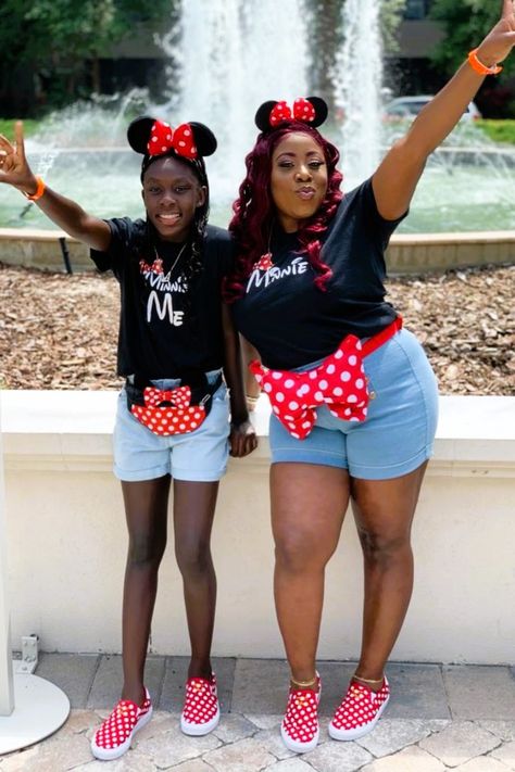 Black woman and her daughter in matching Mommie and Me Disney shirts and Minnie Mouse ears Mom And Daughter Disney Outfits, Mom And Daughter Disney Shirts, Mommy Daughter Shirts Disney, Disney Mother Daughter Shirts, Mother And Daughter Disney Shirts, Mommy And Daughter Disney Shirts, Mommy And Me Disney Outfits, Mommy And Me Disney, Minnie Shirts