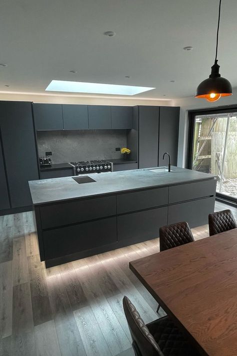 Dark grey kitchen, with grey LVT flooring and copper lights Grey Wooden Floor, Dark Grey Kitchen Cabinets, Flat Kitchen, Direct Wood Flooring, Open Plan Kitchen Dining Living, Flooring Kitchen, Dark Grey Kitchen, Modern Kitchen Design Black, Kitchen Addition