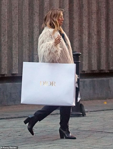 She appeared to have had a successful shopping trip in central London as she toted a huge Dior shopping bag with her in a sign of her designer purchases Louise Redknapp, Turtleneck Jumper, Jenner Family, Turtle Neck Jumper, Designer Paper, Bags Aesthetic, Blue Denim Jacket, Black Trousers, Paper Bags