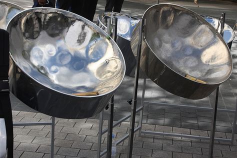 Trinidad's national instrument Steelpans (also known as steel drums or pans, and sometimes, collectively with other musicians, as a steel band or orchestra) is a musical instrument originating from The Republic of Trinidad and Tobago. Steel pan musicians are called pannists. Steel Drums, Band Playing, Steelpan Instrument, Steel Pan Instrument, Traditional Drums, 8 Note Steel Tongue Drum Music, Colombian Musical Instruments, Drum Band, Sabian Cymbals