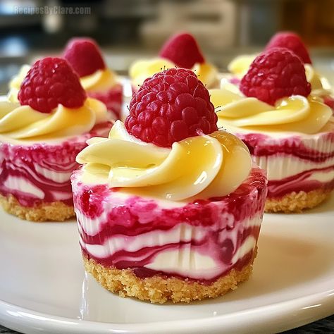 Lemon Raspberry Swirl Cheesecake Cups - Mini Dessert Recipe - Recipes By Clare Raspberry Swirl Mini Cheesecake, Mini Cheesecakes Raspberry, Luscious Lemon Raspberry Swirl, Lemon Raspberry Mini Cheesecake, Lemon Swirl Cheesecake, No Bake Lemon Raspberry Cheesecake Cups, Lemon Raspberry Cheesecake Cupcakes, Mini Lemon Raspberry Cheesecakes, Lemon Raspberry Cheesecake Cups