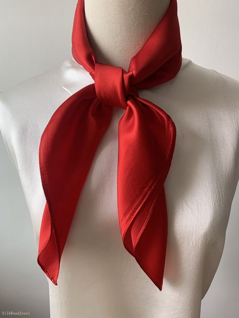 Luxurious natural mulberry silk medium square scarf, color red, size: 65 cm x 65 cm / 26 in x 26 in. Soft, smooth, and lustrous silk charmeuse fabric, breathable and skin-friendly feels very soft and comfortable to wear. Can wear it on both sides which will give different feel and look. Can style in many ways: you can wear this scarf as a soft neck scarf, as a hair tie, as a headband scarf, as a wrist scarf, as a purse accessory. Or style it in any way you want with your own sense of creativity! Suitable for all seasons and is a great gift idea for special occasions. Care Instructions: Pure silk is a type of organic, natural and delicate fabric, please avoid washing. Dry clean recommended. Stored in a cool, dry, and dark place. To smooth out wrinkles and creases naturally, you may hang the Red Silk Scarf Outfit, Neck Scarf Tie, Neck Scarf Styles, Red Neckerchief, Red Neck Scarf, Red Scarf Outfit, Neck Scarf Women, Neck Scarfs, Red Hair Accessories