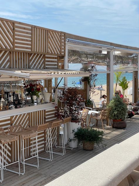 Beach cafe, shoreline, beach, patterns, wood, nature, plants, aesthetic, beige, white, chairs, water, marine, sea Bloxburg Beach Restaurant, Beach Coffee Bar, Seaside Cafe Aesthetic, Coffee Shop On The Beach, Beach Shop Aesthetic, Beach Cafe Design, Beach Cafe Aesthetic, Beach Restaurant Aesthetic, Beach Bar Aesthetic