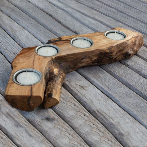 PRICE IS FOR THE PAIR A wonderful rustic, live edge Dog Wood Tea-light Holder. This table centrepiece takes four standard tea-lights. This character piece of dogwood was cut from a tree that had suffered fire damage resulting in it being contorted and disfigured. Fitted with metal liners. The dogwood has rich colours and having been cut from a wavy log it also has characterful grain patterns. It has been planed and sanded to an extremely smooth finish. The wood has been waxed and buffed to a wonderful sheen. This centrepiece would look great in any home enhancing the dining table, coffee table or mantlepiece. For wedding or banqueting tables the holder can be used alongside our wood slices. Measuring 34 cm Long x 10 cm Wide x 4 cm Thick  The pieces in the photograph are the ones you will r Raw Edge Wood Projects, Wood Log Ideas, Wood Tea Light Holder, Wood Slice Decor, Log Projects, Workbench Plans Diy, Etsy Decor, Wood Projects That Sell, Rustic Candle Holders