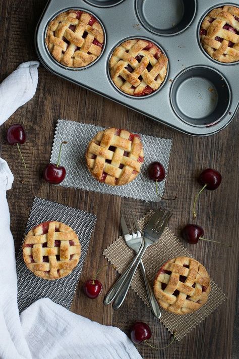 Homemade cherry pies with a pretty lattice top. Summer Picnic Desserts, Mini Cherry Pies, Cherry Pies, Picnic Desserts, Homemade Cherry Pies, Almond Pastry, Fruit Dip, Mini Pies, Muffin Tins