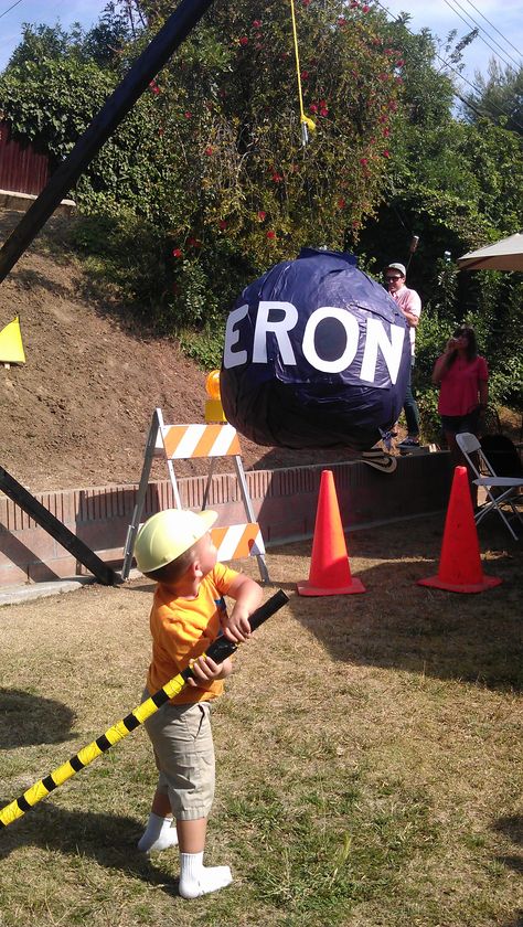 Cam hitting the wrecking ball! #wreckingball #pinata #constructionparty #3yearoldparty #DIY Wrecking Ball Pinata, Diy Wrecking Ball, Roman Party, Digger Party, Pool Party Food, Bday Party Kids, Truck Birthday, Wrecking Ball, Construction Party