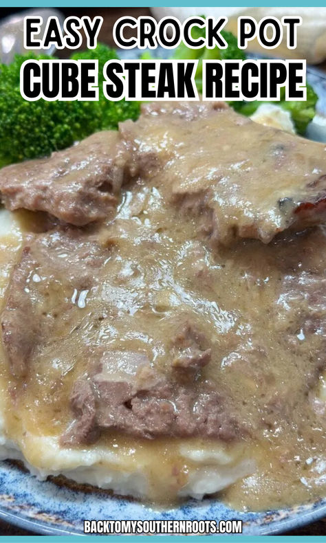 cube steak with gravy on top of mashed potatoes for a delicious dinner. Crockpot Cube Steak Cream Of Mushroom, Low Carb Cube Steak Recipes Crock Pot, Crock Pot Cube Steak Slow Cooker, Cube Steak Crock Pot Recipes Crockpot, Cube Steaks In Crock Pot, Slow Cooker Cubed Steak Crockpot, Country Style Steak In Crock Pot, Crockpot Cubed Steak And Gravy, Cube Steak Crock Pot Recipes Easy