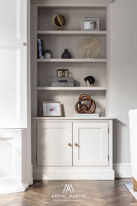 The open plan family space moves into a modern luxe living room. Echoing the same warm neutral palette with brass accents, the consistent use of hardware makes for a seamless and cohesive finish. Featuring our Cotswold Drawer Pull⁠ and Cotswold Ball Knob ⁠in burnished brass finish on perfectly styled living room shelves. Alcove Storage Living Room, Cupboard Living Room, Alcove Ideas Living Room, Living Room Cupboards, Alcove Shelves, Alcove Storage, Alcove Cabinets, Alcove Shelving, Armac Martin