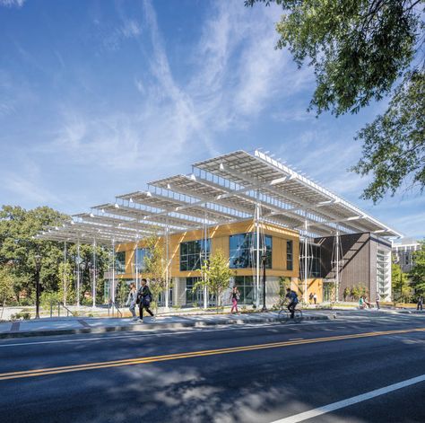 The new center is pursuing Living Building certification, widely regarded as the industry's most rigorous sustainability credential. Solar Panels Architecture, Solar Panel Design, Solar Canopy, Small Hospital, Commercial Building Design, Beach Pavilion, Coffee Factory, Public Pool, Hospital Building