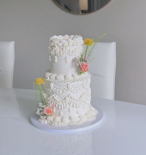 the vintage floral cake of my dreams 🌸🌿🤍 - - - - - - pipingtips / buttercream cake / buttercream decorating / cake design / cake decorating /tampa vintage cake / cake decorator / buttercream piping / vintage cake / pink cake / cake business / tampa bakery / tampa cakes / birthday cake / mini cakes / tall vintage cake / lambeth piping / floral cake / baby shower cake / baby sprinkle cake Cake Buttercream Decorating, Baby Sprinkle Cake, Lambeth Piping, Vintage Floral Cake, Birthday Cake Mini, Buttercream Piping, Buttercream Decorating, Cake Mini, Cake Buttercream