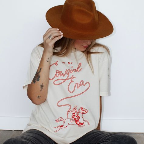 Calling all Cowgirls. 🌵🤠 Brand New In My Cowgirl Era Tee out now! Cowgirl Era, Retro Cowgirl, Slogan Tees, A Bull, Slogan Tee, Western Theme, June 19, Cotton Bag, Sunflower