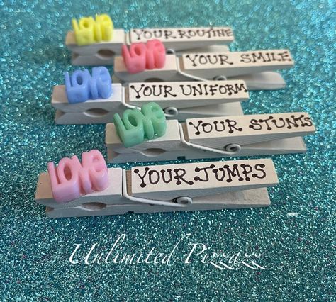 Unlimited Pizzazz offers fun and affordable cheer pins / spirit clips for your cheerleading season.  These pins are made with quality, wooden clothes pins and hand-decorated with fun and unique embellishments.  Affordable so that everyone can share their spirit and good luck wishes around the world!   These clips are custom, hand-made and sometimes, hand-written so slight imperfections should be accepted.  We use quality embellishments to provide the best quality possible. BUY THEM - SHARE THEM - COLLECT THEM ALL!  Cheer pins / Spirit Clips are a fun and fabulous way to spread good sportsmanship at your next competition! This item includes 5 customized clips as pictured above.  Will ship within 2 business days of payment via USPS.   Need more?  Want custom clips for your team?  Contact us! Cheerleader Spirit Gifts, Cheer Clip Ideas, Cheer Incentives, Cheer Pins Sayings, Cheer Clips For Backpacks Ideas, Hit Zero Cheer Pins, Good Luck Cheer Clothes Pins, Cheer Camp Clothes Pins, Cheer Cloths Pins