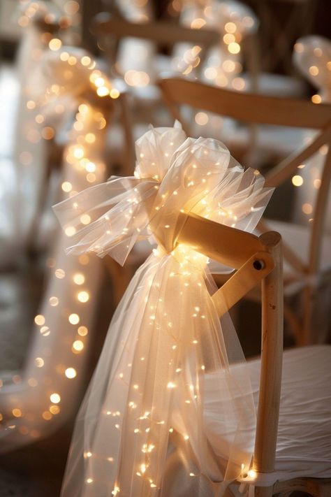 Transform your wedding into a fairytale with these stunning chair decorations. Tulle sashes and fairy lights add an ethereal touch to your reception. ✨🎀💡 Easy DIY setup for a night of wonder. #WeddingInspiration #FairyLights #DIYWedding #WeddingDecor #TulleDecorations #MagicalEvening #BridalStyle #WeddingChairDecor Let the romance sparkle! Wedding Dance Party Aesthetic, Nighttime Wedding Send Off, Tulle And Fairy Lights, Wedding Twinkle Lights, Fairy Light Wedding, Wedding Fairy Lights, Twinkle Lights Wedding, Wedding Chair Decor, Tulle Decorations